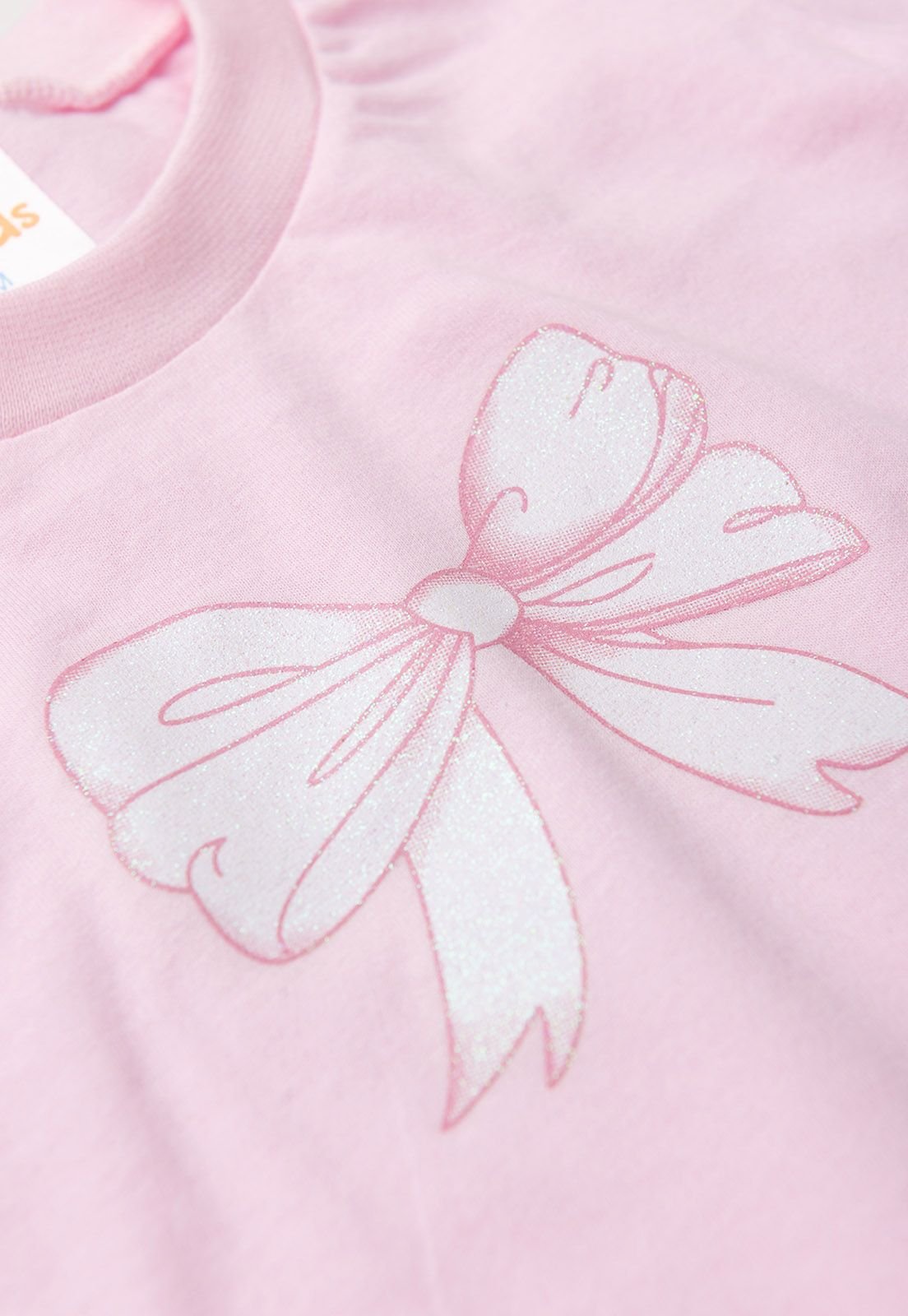 Detalhe: Estampa de la&ccedil;o do Conjunto Blusa e Shorts Ame Kids, cor Rosa
