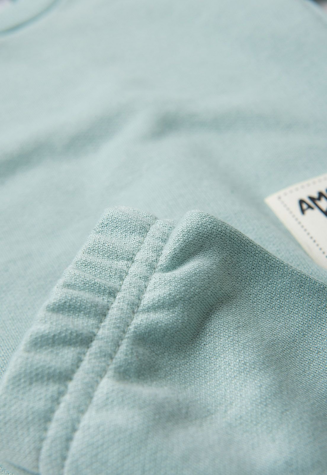 Detalhe: Punhos canelados do Conjunto Blusa e Cal&ccedil;a de Moletom Ame Kids, cor Verde
